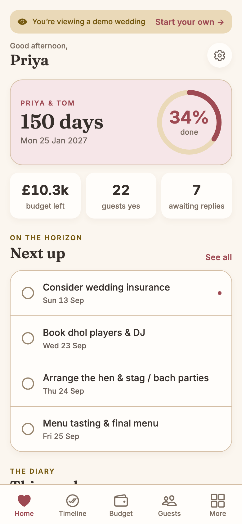 Priya and Tom's home screen in the app: a banner reading 'You're viewing a demo wedding — Start your own', a countdown card for PRIYA & TOM showing 150 days, Mon 25 Jan 2027 and a 34% done ring, tiles reading £10.3k budget left, 22 guests yes and 7 awaiting replies, and a 'Next up' list beginning 'Consider wedding insurance' and 'Book dhol players & DJ'.